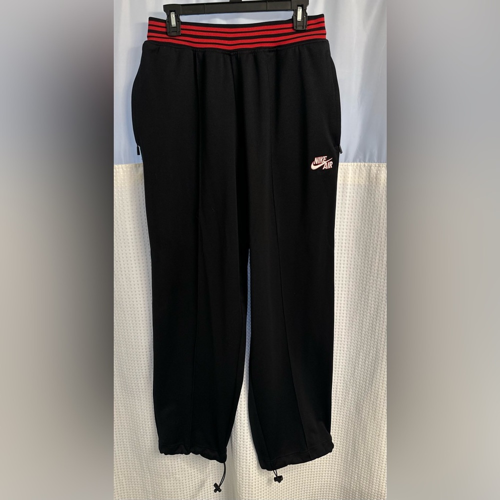 NikeAir joggers- Men size LARGE/ BLACK PLEATED w/ RED stripes at waist.